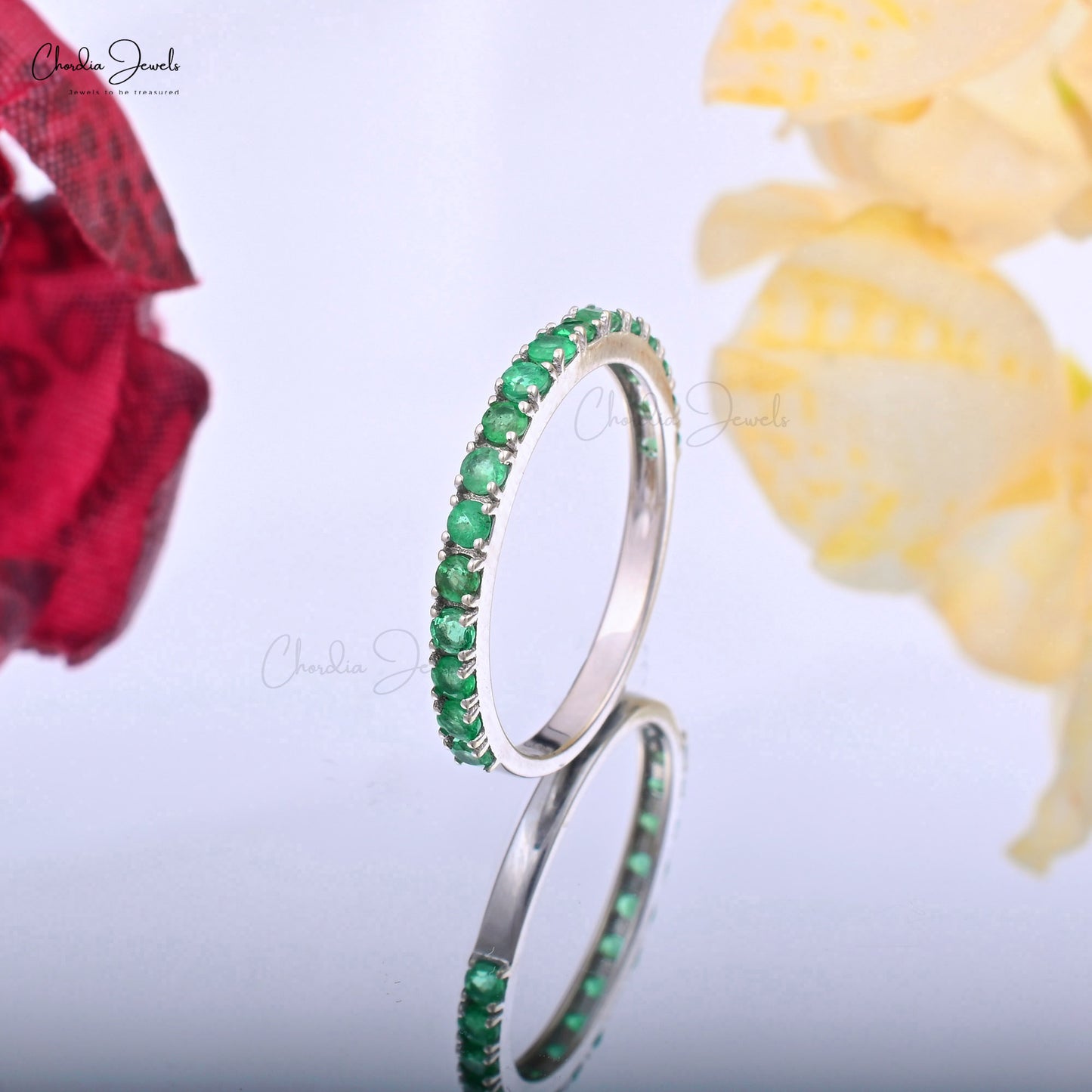 Discover the perfect blend of style with this emerald eternity ring