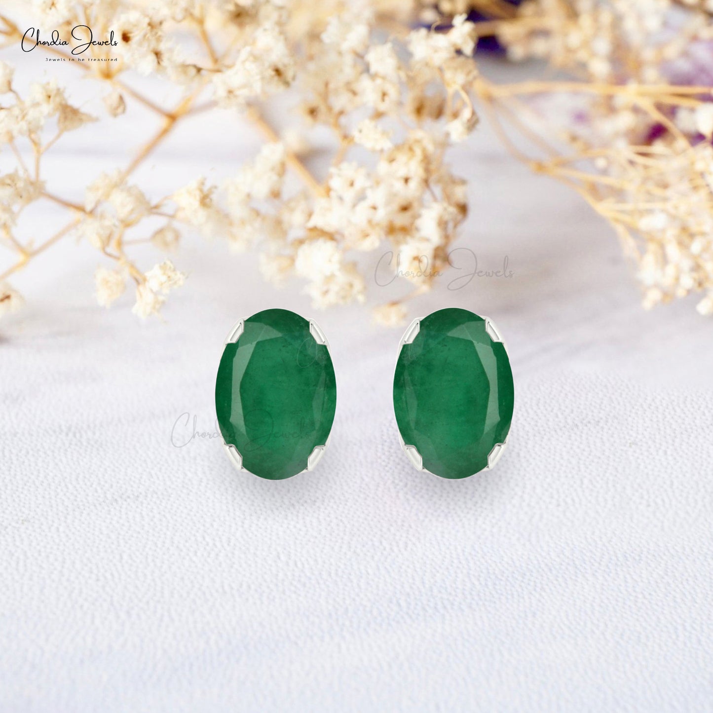Unveil the magic of our oval emerald earrings.