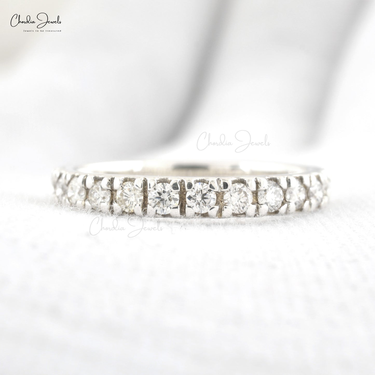 Fine gold wedding band with continuous round-cut white diamonds
