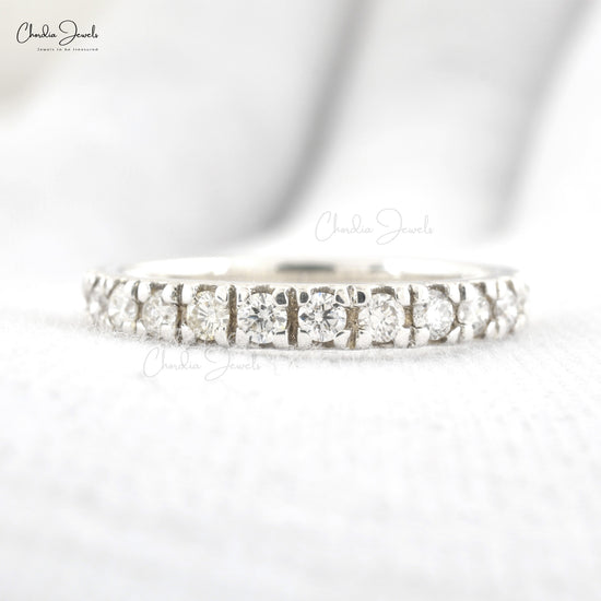 Fine gold wedding band with continuous round-cut white diamonds