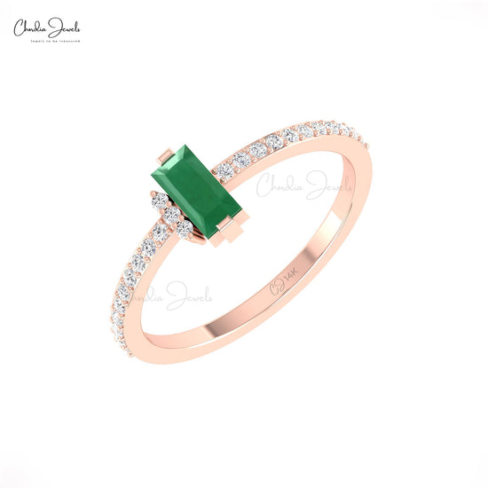 Elevate your look with these emerald & diamond ring.