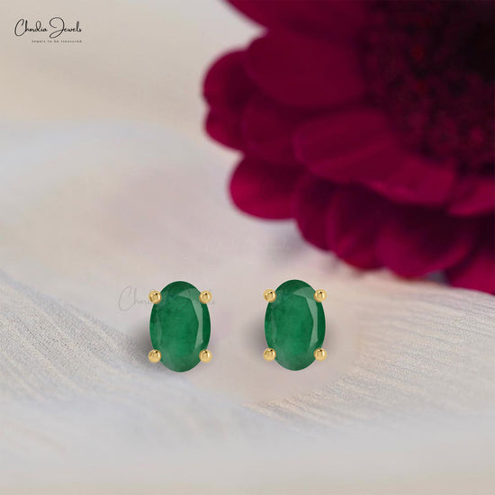 Discover the perfect blend of style with these oval emerald earrings.