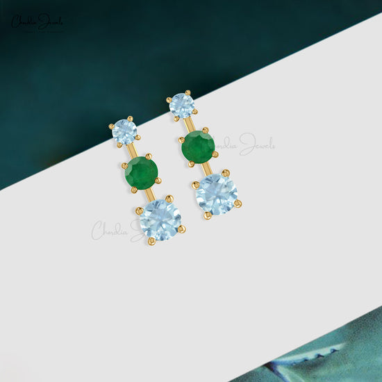 Indulge in the luxury of our emerald & aquamarine earrings.