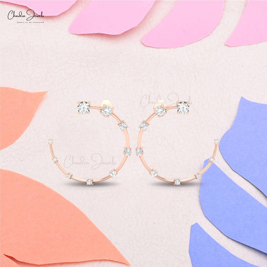 constella style half moon gold earrings with white round diamonds