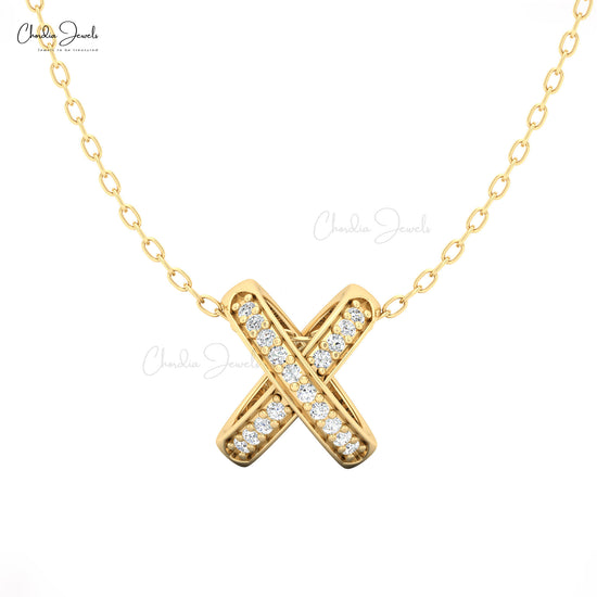 Modern X design pendant in gold with sparkling diamonds