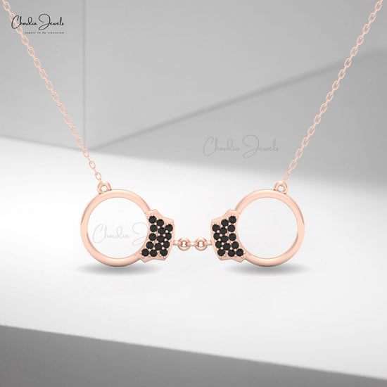 Elegant women’s gold necklace with black diamond handcuff charm