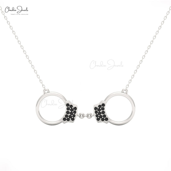 Women’s fine jewelry necklace with handcuff pendant and black diamonds