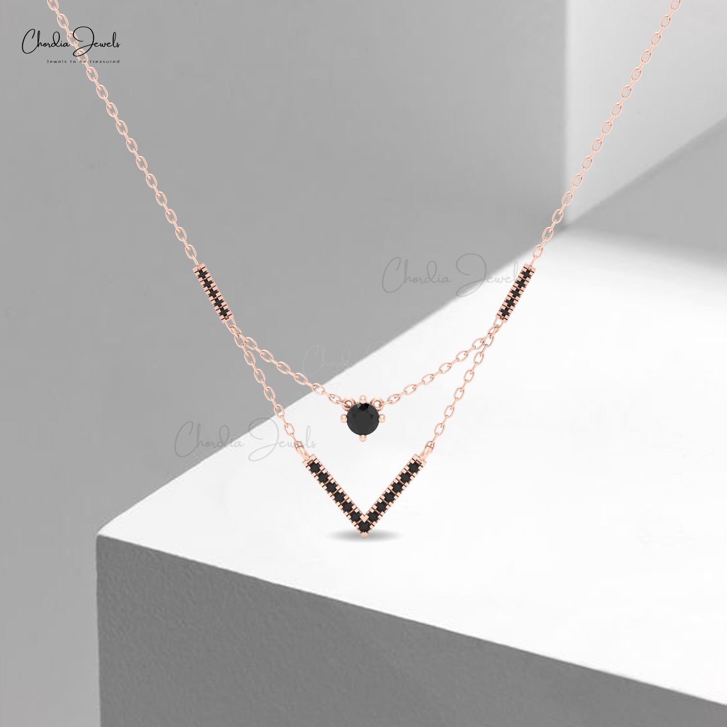 Chveraon 14k solid gold necklace featuring black diamonds.