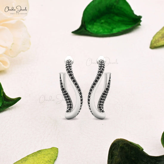 Delicate 14k gold twisted earrings accented with black diamonds