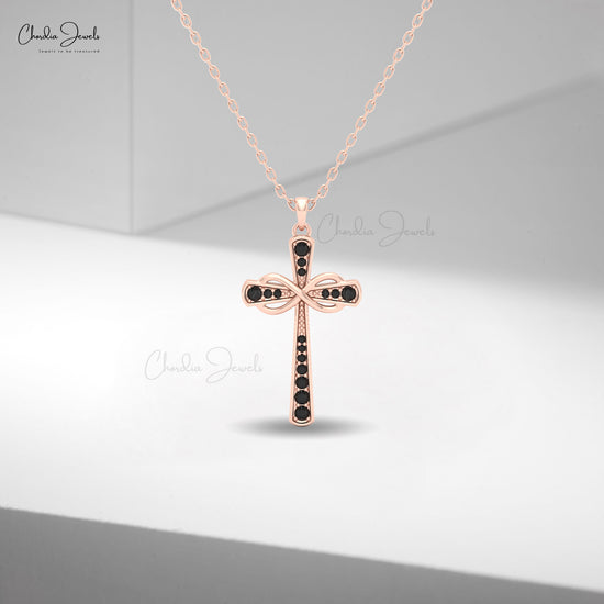 Women’s 14k rose gold infinity pendant adorned with round black diamonds in pavé setting.