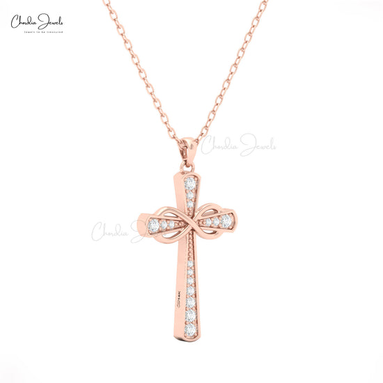 14k solid gold cross pendant for women with white diamonds and ribbon-style detailing by Chordia Jewels.