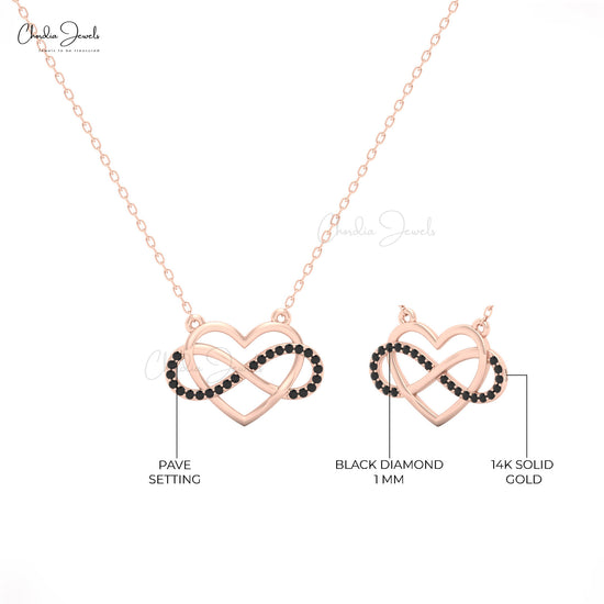14k yellow gold necklace with heart-shaped pendant and black diamond center