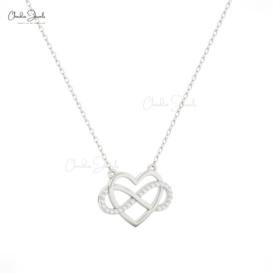 Infinity symbol pendant necklace in 14k gold featuring white diamonds