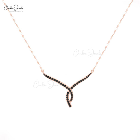 Black diamond necklace in 14K gold with elegant twisted detailing.