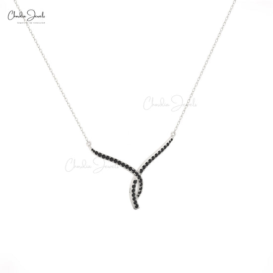 Luxury women's necklace with twisted 14K gold and black diamond accents.