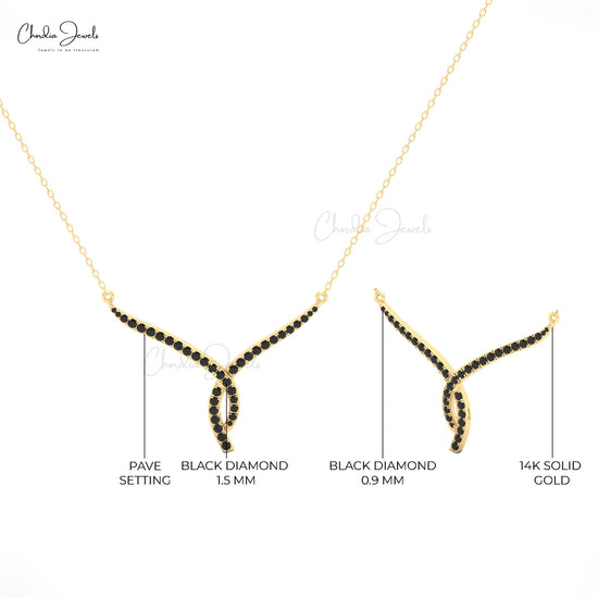 Bold and modern black diamond necklace in twisted 14K gold design.