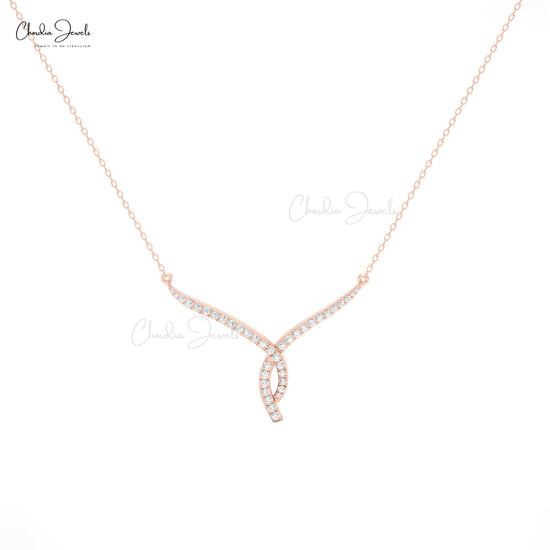 Gorgeous twisted V necklace in 14K gold with white diamonds, the perfect wedding accessory.