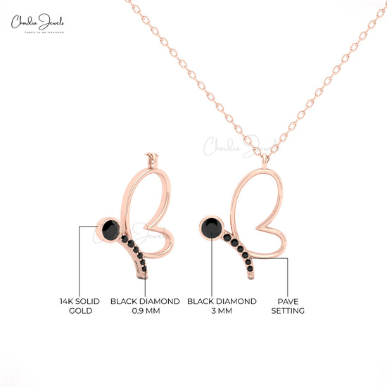 Delicate butterfly pendant necklace with black diamond in gold.