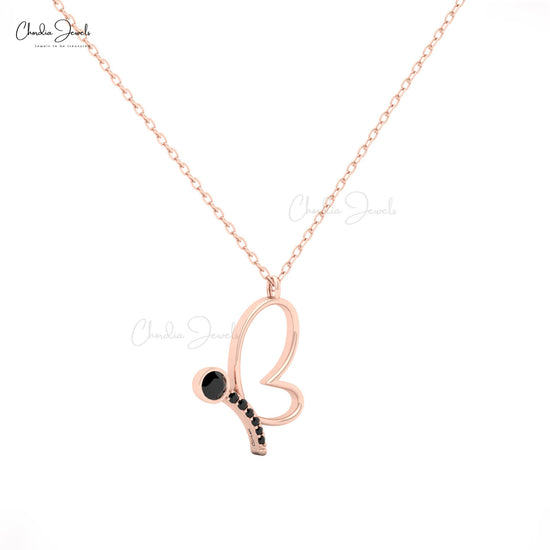 Elegant 14K gold butterfly necklace with black diamond pendant.