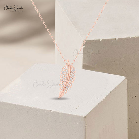 Delicate gold leaf pendant with white stones