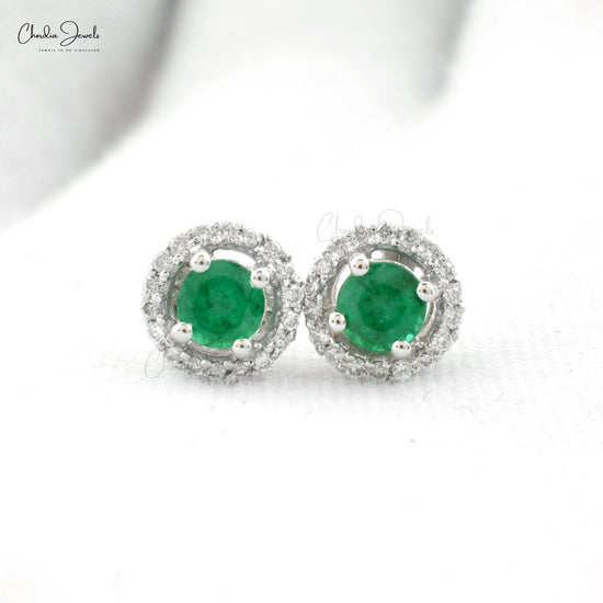 Make a statement with our emerald and diamond earrings.
