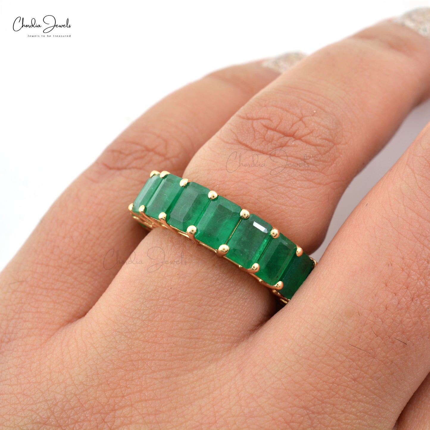 gold band emerald ring