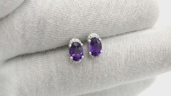Load and play video in Gallery viewer, Oval Cut Amethyst Stud Earrings in 14k Solid White Gold Diamond
