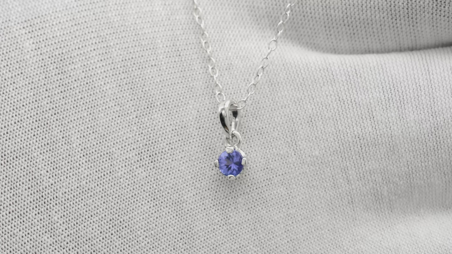 Load and play video in Gallery viewer, Round Brilliant Cut 4mm Natural Blue Tanzanite Solitaire Pendant, 0.23 Ct December Birthstone Gemstone Pendant For Gift, 14k Solid White Gold 4-Prong Set Hallmarked Jewelry
