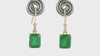 Adorn yourself with these emerald and diamond earrings.