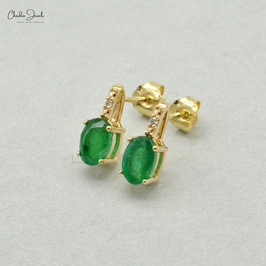 Captivate hearts with these 14k gold emerald earrings.