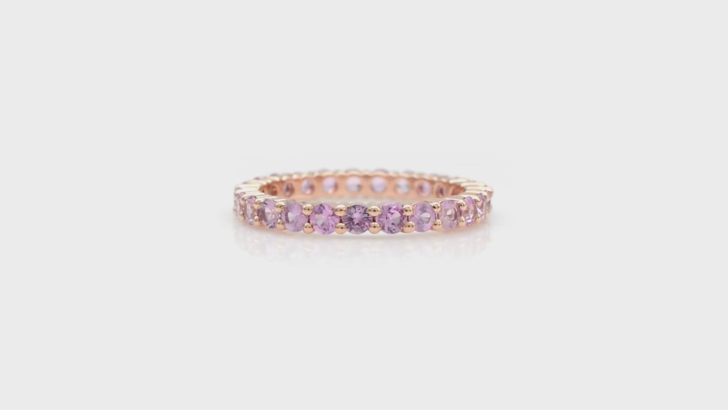 Load and play video in Gallery viewer, Gemstone Eternity Band With 2.5mm Pink Sapphire Stackable Wedding Ring In 14k Rose Gold
