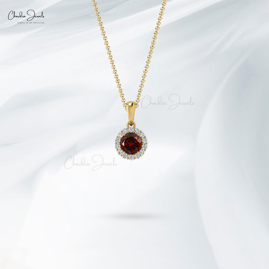 claw set 4mm red garnet pendant with diamond halo accent