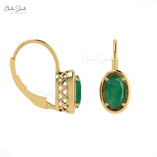 Adorn yourself with these 14k gold emerald earrings.