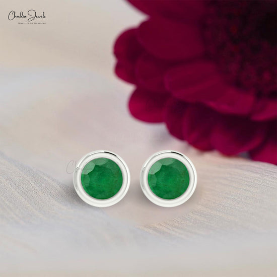 Adorn yourself with these emerald gemstone studs.