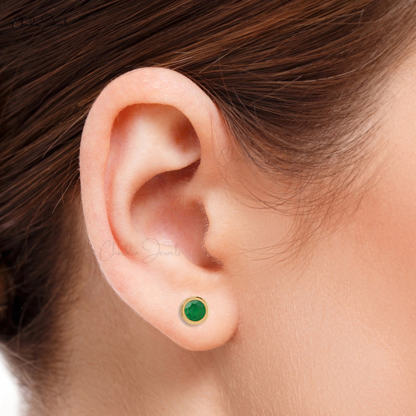 Make a statement with these single stone emerald earrings.