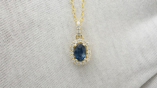Load and play video in Gallery viewer, Natural Blue Sapphire Pendant, 14k Solid Yellow Gold Halo Pendant, 7x5mm Oval Faceted Gemstone Pendant, September Birthstone Pendant Gift for Her
